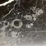 Stains and etching on black marble countertops