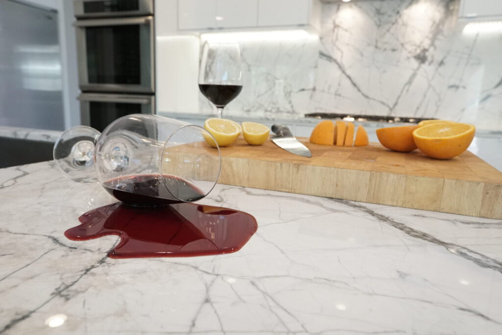 Red wine and citrus fruits exposed to marble countertops, which are protected by TuffSkin Surface Protection