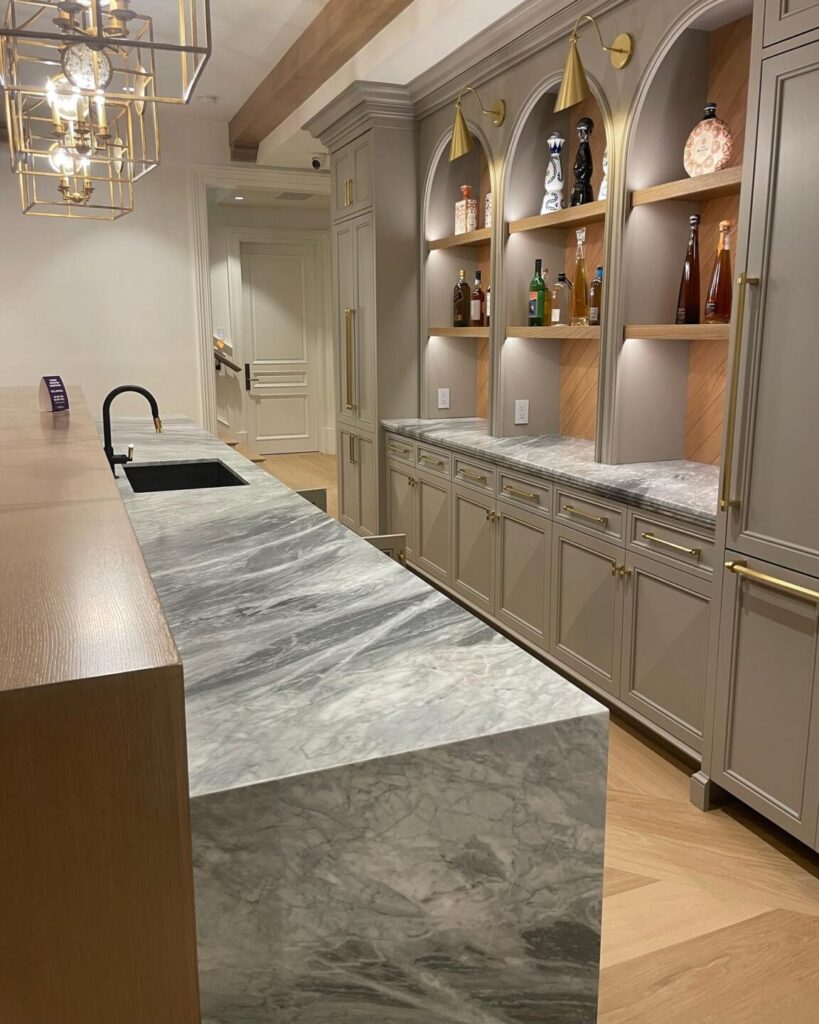 Under cabinet lights highlighting countertops in beautiful high-end kitchen