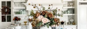 Beautiful floral arrangement at center of marble kitchen island