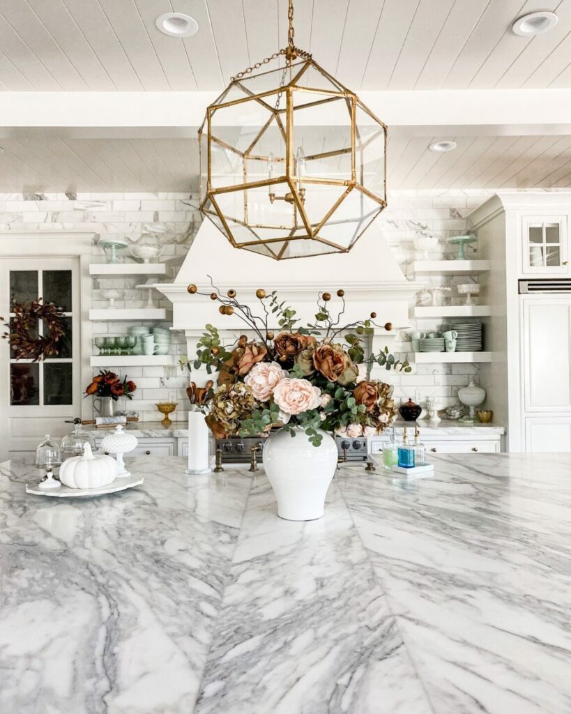 Beautiful floral arrangement on the center of marble kitchen island